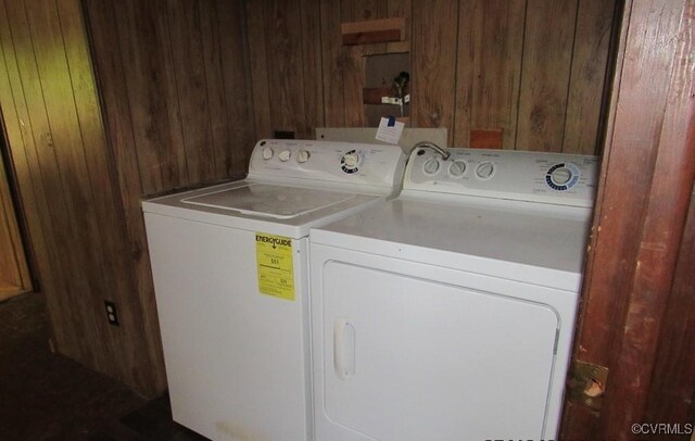 27701 W Prince Edward Hwy, Burkeville, VA 23922 - laundry room with washer and clothes dryer and wood walls
