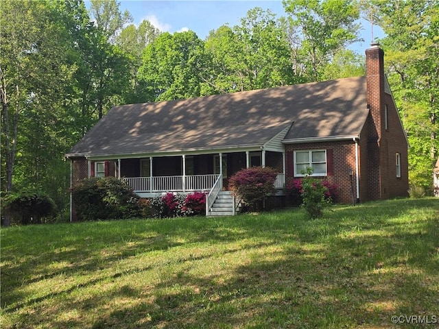 4850 Old Fredericksburg Rd, Mineral, VA 23117 - view of front of property with a front lawn, a chimney, brick siding, and a shingled roof