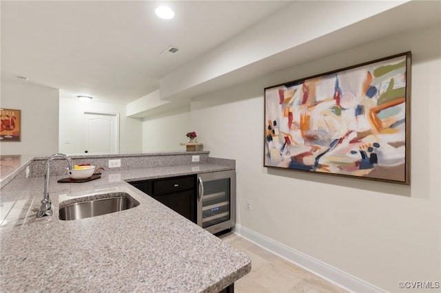 16412 Ravenchase Way, Moseley, VA 23120 - kitchen with wine cooler and light stone countertops