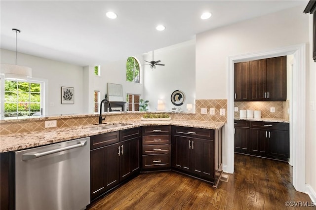 16412 Ravenchase Way, Moseley, VA 23120 - kitchen with stainless steel dishwasher, dark wood-style flooring, light stone counters, dark brown cabinets, and decorative backsplash