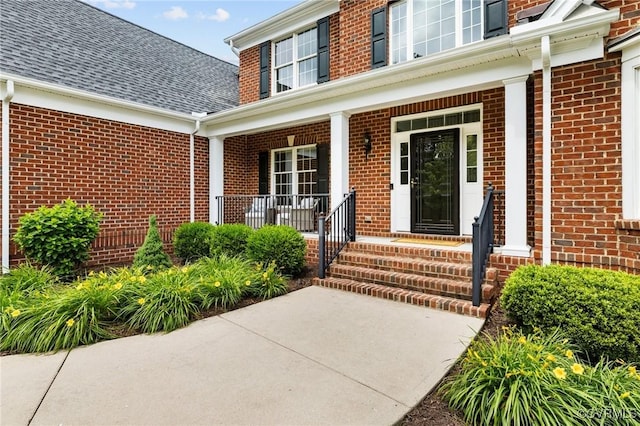 16412 Ravenchase Way, Moseley, VA 23120 - view of exterior entry with brick siding, covered porch, and roof with shingles