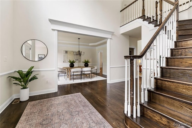 16412 Ravenchase Way, Moseley, VA 23120 - foyer entrance with wood finished floors, stairway, ornamental molding, and a chandelier