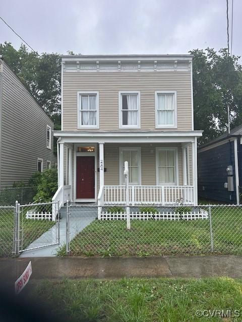 view of front of home featuring covered porch, a fenced front yard, and a gate