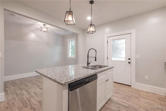 kitchen with stainless steel dishwasher, a sink, light wood-style flooring, and white cabinetry