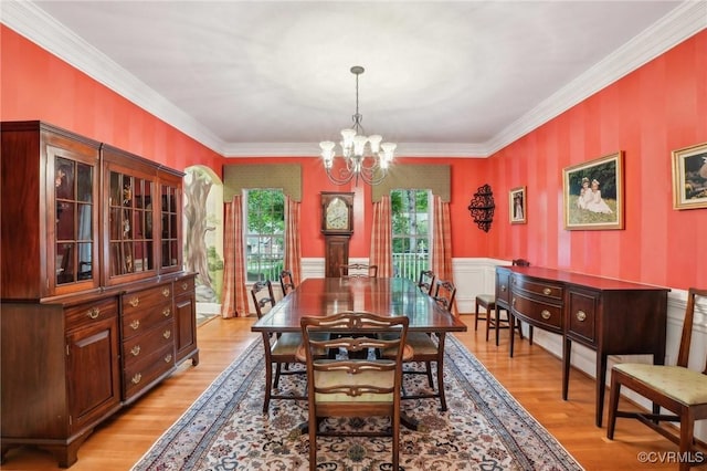 9226 Shelton Pointe Dr, Mechanicsville, VA 23116 - dining room with a chandelier, light wood-style flooring, ornamental molding, a wainscoted wall, and wallpapered walls