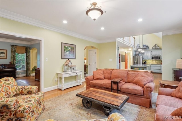 9226 Shelton Pointe Dr, Mechanicsville, VA 23116 - living room with arched walkways, light wood-style flooring, crown molding, and recessed lighting