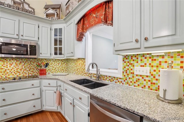 9226 Shelton Pointe Dr, Mechanicsville, VA 23116 - kitchen with a sink, appliances with stainless steel finishes, backsplash, light stone counters, and ornamental molding