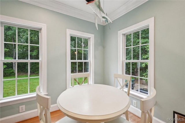 9226 Shelton Pointe Dr, Mechanicsville, VA 23116 - dining room with crown molding, light wood-style flooring, and baseboards