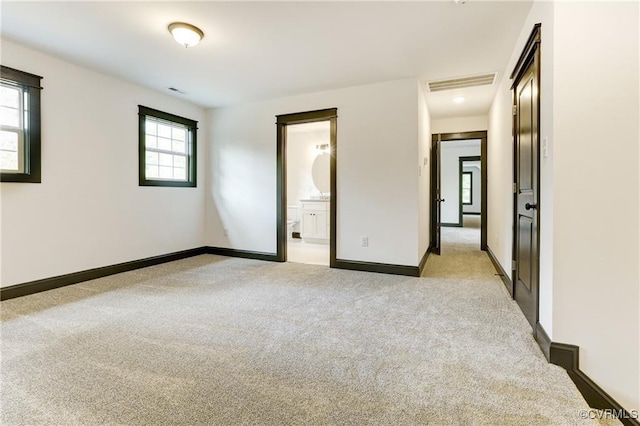 170 Glenmore Ln, Keswick, VA 22947 - unfurnished bedroom with light colored carpet, baseboards, and ensuite bathroom