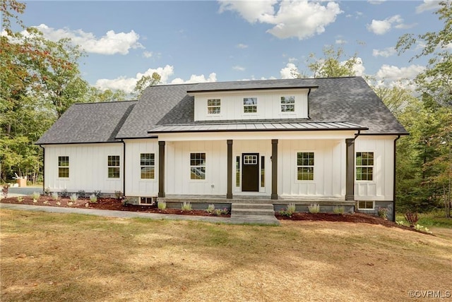 170 Glenmore Ln, Keswick, VA 22947 - modern farmhouse style home with board and batten siding, a standing seam roof, and a front lawn