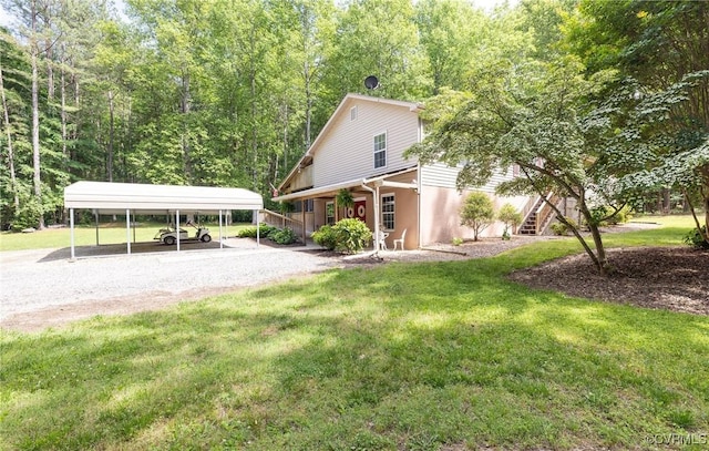 12727 Lodore Rd, Amelia Courthouse, VA 23002 - view of front of home with a carport, a front lawn, driveway, stairs, and a porch