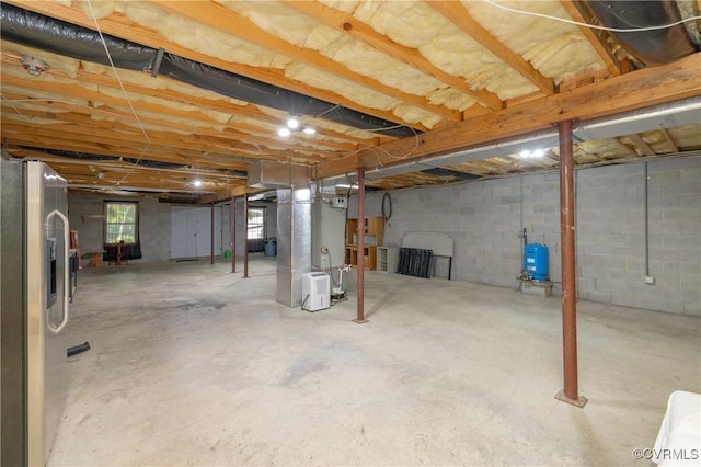 12727 Lodore Rd, Amelia Courthouse, VA 23002 - basement with stainless steel fridge and a water pressure tank