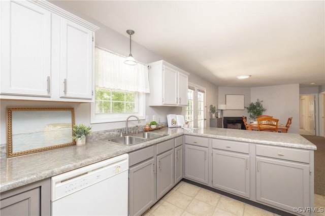 12727 Lodore Rd, Amelia Courthouse, VA 23002 - kitchen with white dishwasher, a sink, a peninsula, gray cabinets, and light countertops