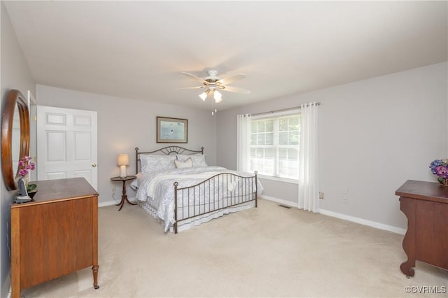 12727 Lodore Rd, Amelia Courthouse, VA 23002 - bedroom with light colored carpet, baseboards, and a ceiling fan