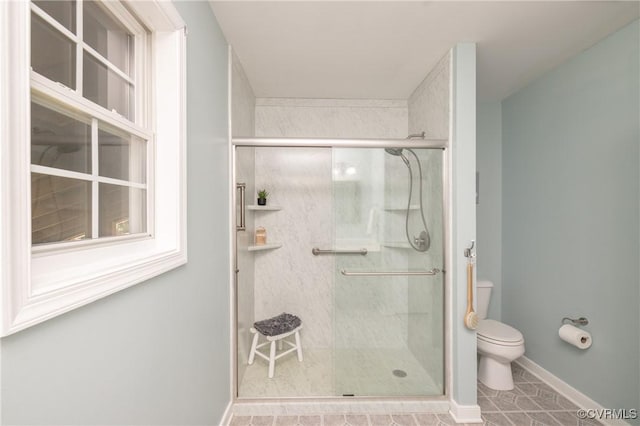 12727 Lodore Rd, Amelia Courthouse, VA 23002 - full bath featuring toilet, a stall shower, tile patterned flooring, and baseboards
