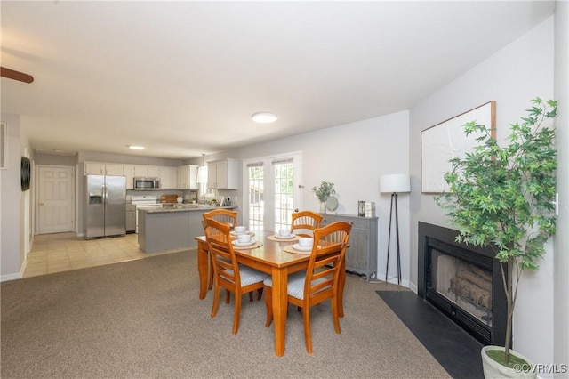 12727 Lodore Rd, Amelia Courthouse, VA 23002 - dining area with a fireplace with flush hearth, light carpet, baseboards, and recessed lighting