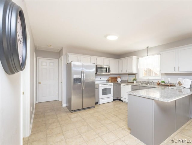 12727 Lodore Rd, Amelia Courthouse, VA 23002 - kitchen with stainless steel appliances, a peninsula, white cabinetry, a sink, and light flooring