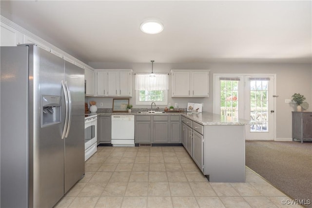 12727 Lodore Rd, Amelia Courthouse, VA 23002 - kitchen with white appliances, a sink, a peninsula, decorative light fixtures, and gray cabinets