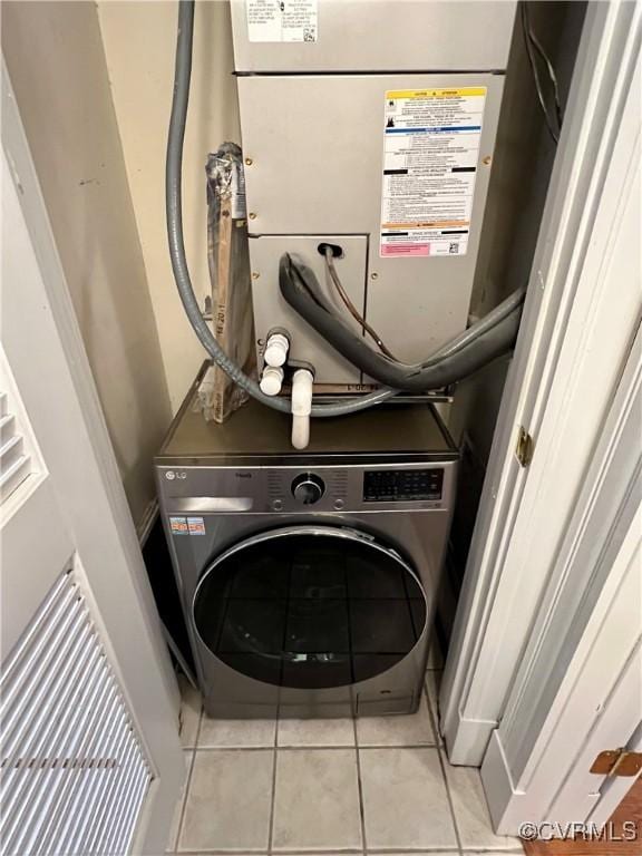laundry area featuring washer / clothes dryer and tile patterned floors