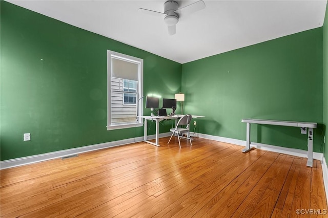 1415 N 25th St, Richmond, VA 23223 - home office featuring a ceiling fan, hardwood / wood-style floors, and baseboards
