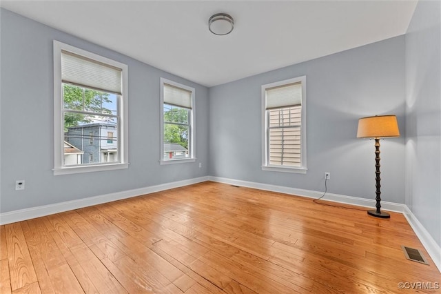 1415 N 25th St, Richmond, VA 23223 - unfurnished room featuring baseboards and light wood finished floors