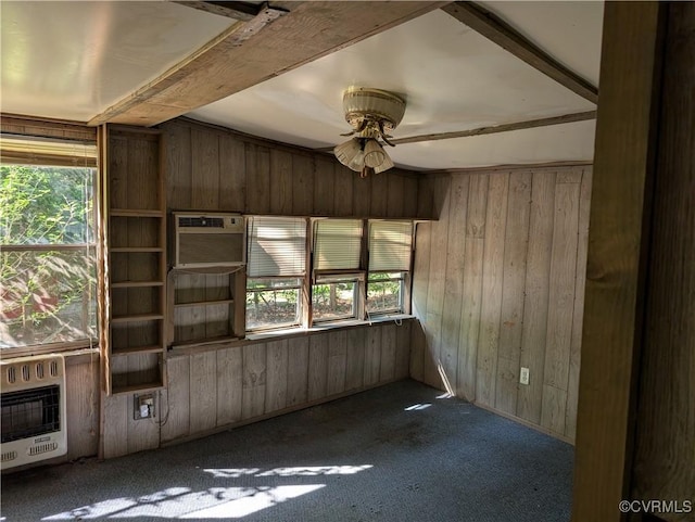 1555 Holly Hills Rd, Powhatan, VA 23139 - empty room featuring a ceiling fan, wood walls, plenty of natural light, dark carpet, and heating unit