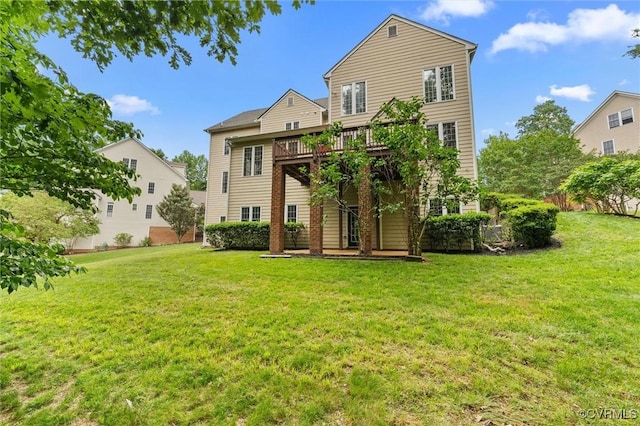 back of property with a deck and a lawn
