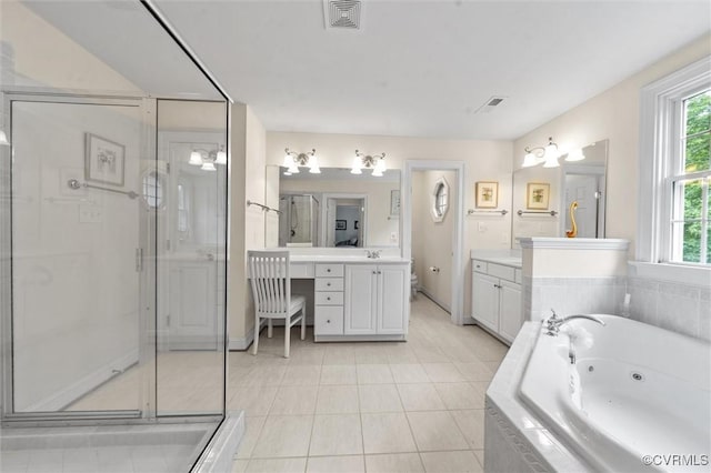 full bathroom with a shower stall, a tub with jets, tile patterned floors, vanity, and baseboards