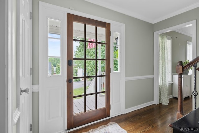 doorway to outside featuring ornamental molding, dark wood-type flooring, stairway, and baseboards
