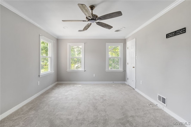 unfurnished room featuring ornamental molding, carpet, ceiling fan, and baseboards