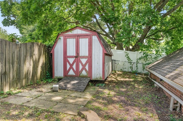 view of shed featuring a fenced backyard