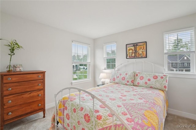 carpeted bedroom with baseboards