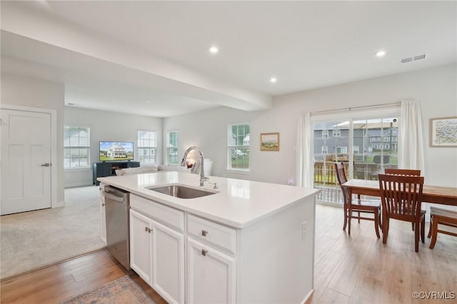 kitchen with a sink, dishwasher, open floor plan, an island with sink, and recessed lighting
