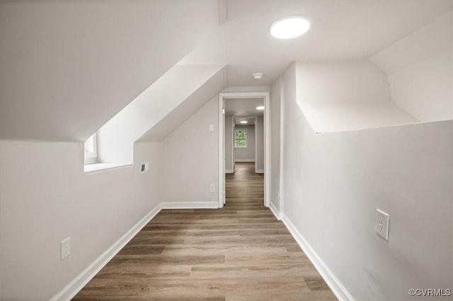 201 W Roanoke St, Ridgeway, VA 23225 - additional living space featuring vaulted ceiling, wood finished floors, and baseboards
