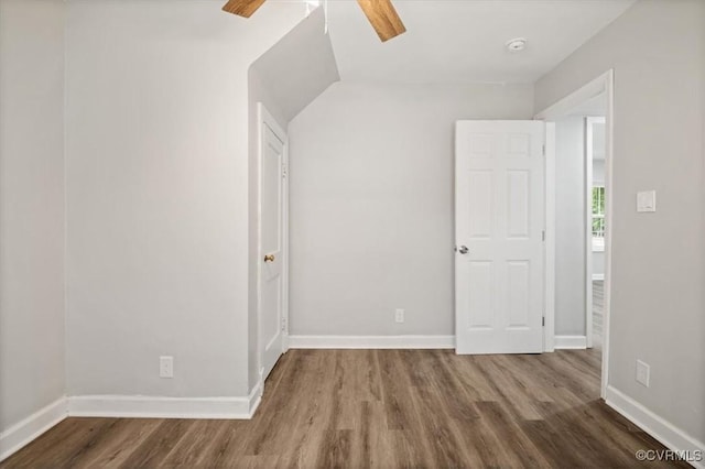 201 W Roanoke St, Ridgeway, VA 23225 - empty room with wood finished floors, ceiling fan, and baseboards