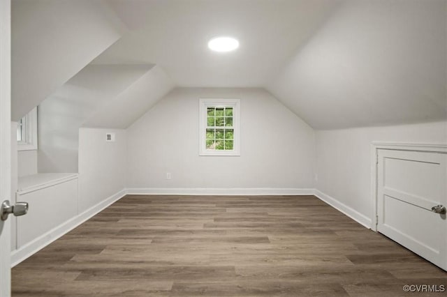 201 W Roanoke St, Ridgeway, VA 23225 - additional living space with wood finished floors, baseboards, and lofted ceiling