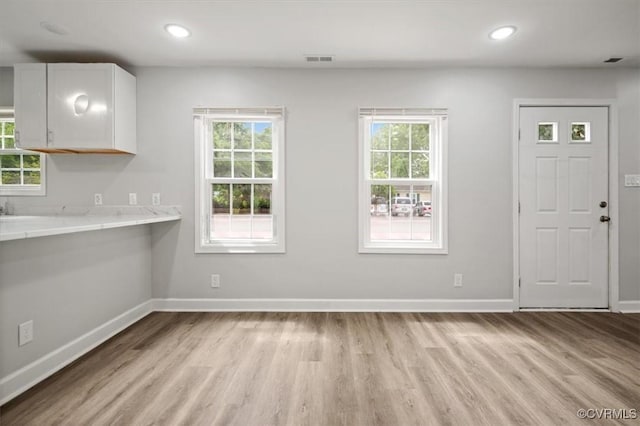201 W Roanoke St, Ridgeway, VA 23225 - unfurnished dining area with light wood-style flooring, baseboards, healthy amount of natural light, and recessed lighting