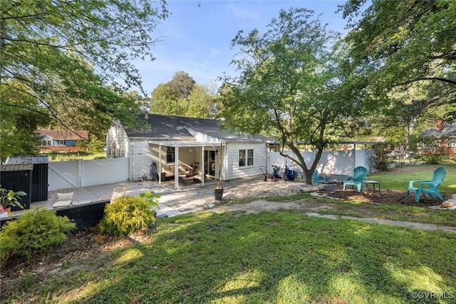 rear view of house with a deck and a patio area