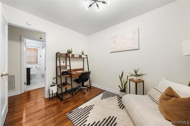 office featuring wood finished floors and baseboards