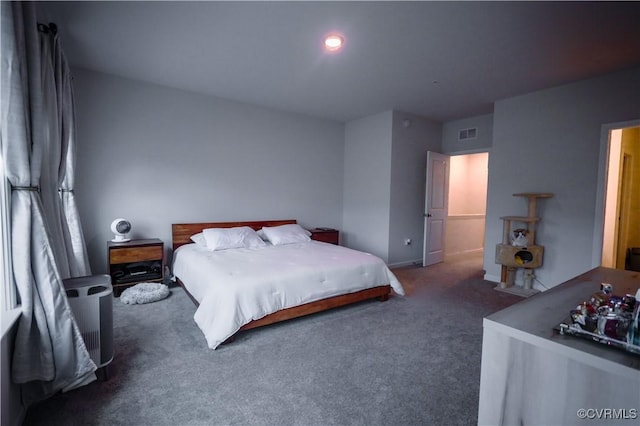 bedroom featuring carpet and baseboards
