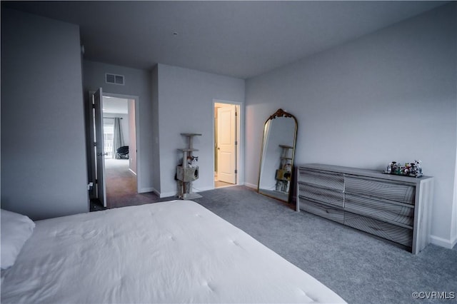 carpeted bedroom featuring baseboards