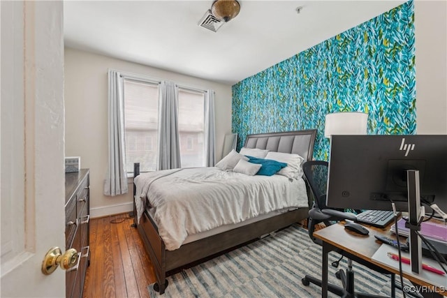 317 N 2nd St Unit B, Richmond, VA 23219 - bedroom featuring wood-type flooring, baseboards, an accent wall, and a desk