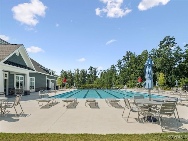 5920 Banyan Ln, Chesterfield, VA 23234 - community pool featuring a patio area and view of wooded area