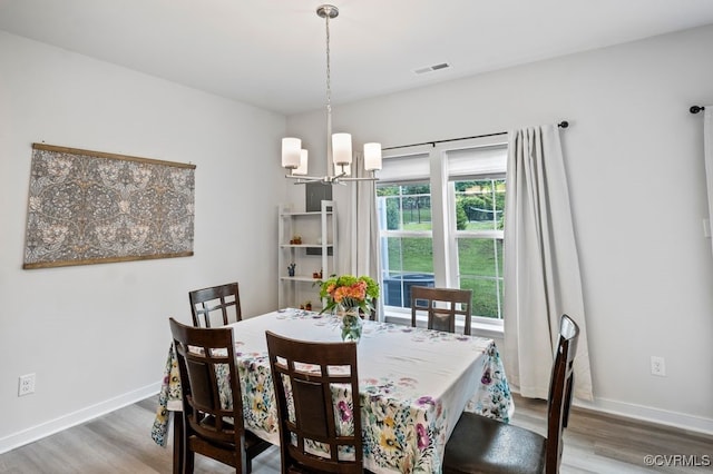 11348 Benton Pointe Way, Chester, VA 23831 - dining room featuring a chandelier, wood finished floors, and baseboards