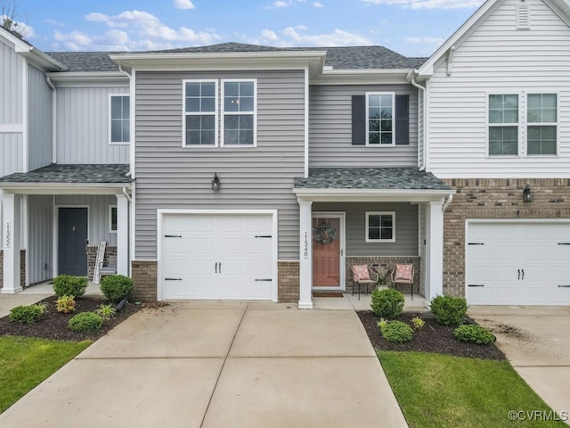 11348 Benton Pointe Way, Chester, VA 23831 - multi unit property with concrete driveway, board and batten siding, an attached garage, brick siding, and covered porch