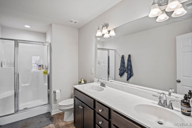 11348 Benton Pointe Way, Chester, VA 23831 - full bath with a shower stall, toilet, double vanity, wood finished floors, and a chandelier