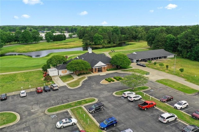 bird's eye view of a nearby body of water and a golf course