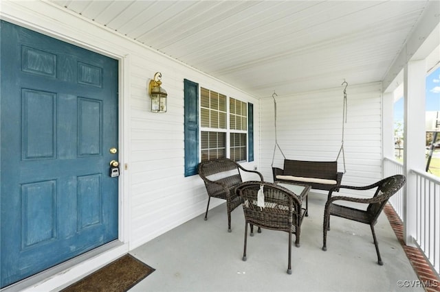 view of exterior entry featuring a porch