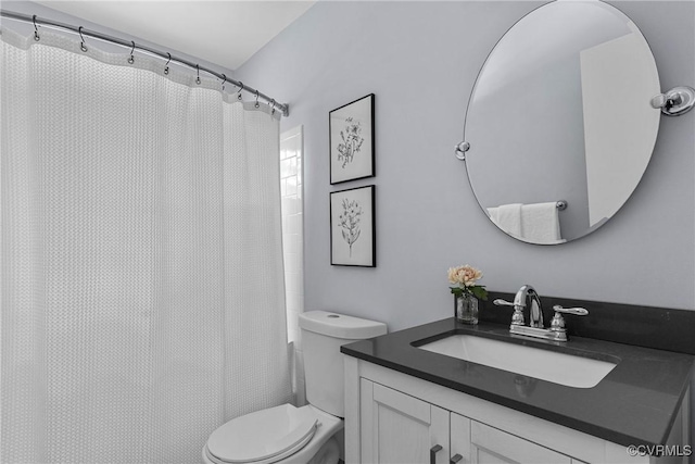 full bathroom with toilet and vanity