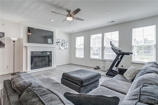 12106 Oxford Landing Dr Unit 202, Glen Allen, VA 23059 - living room with a ceiling fan, a fireplace, baseboards, and wood finished floors